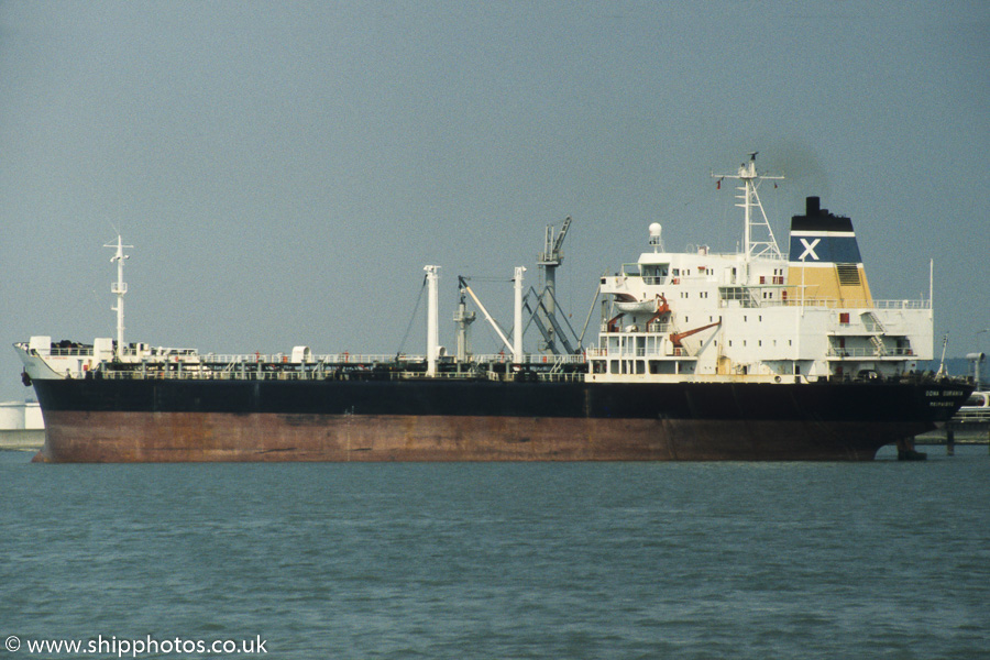 Photograph of the vessel  Dona Ourania pictured at Coryton on 17th June 1989