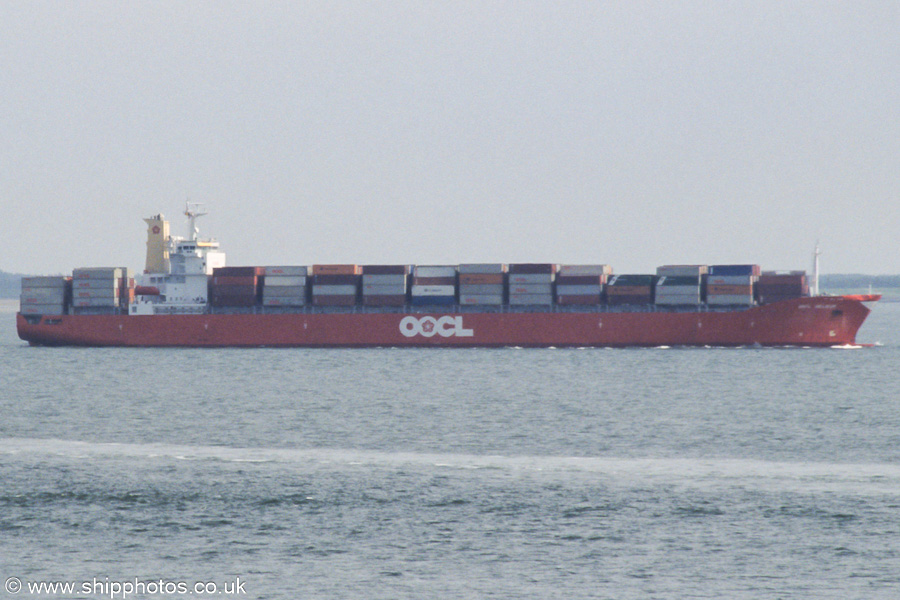 Photograph of the vessel  OOCL Belgium pictured on the Westerschelde passing Vlissingen on 19th June 2002