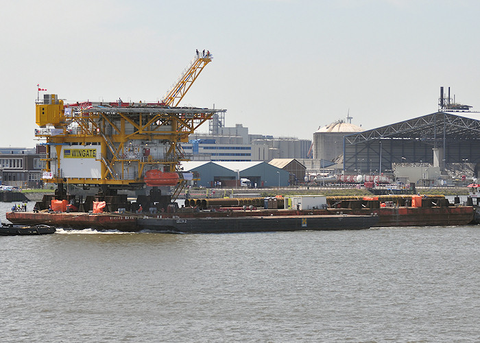 Photograph of the vessel  Viking Barge 1 pictured passing Vlaardingen under tow on 27th June 2011